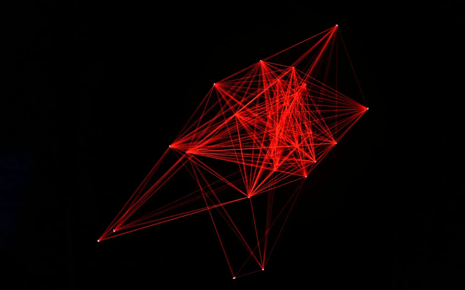 Red laser wireframe network of nodes on black