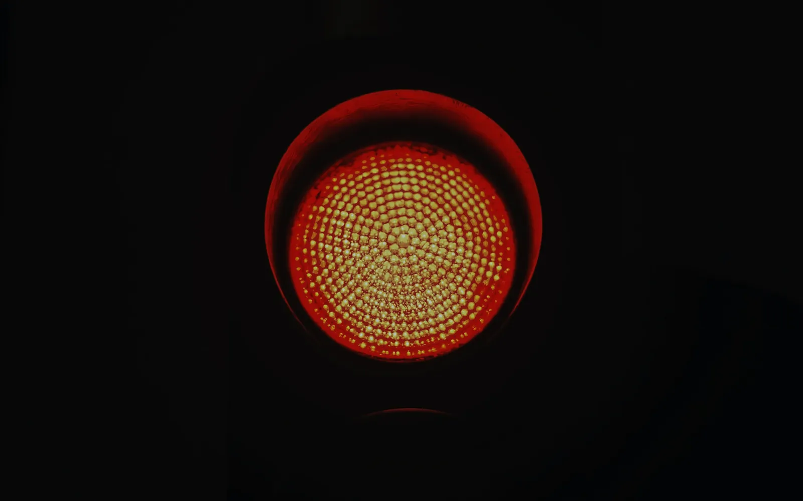 Red signal lamp glowing in the dark
