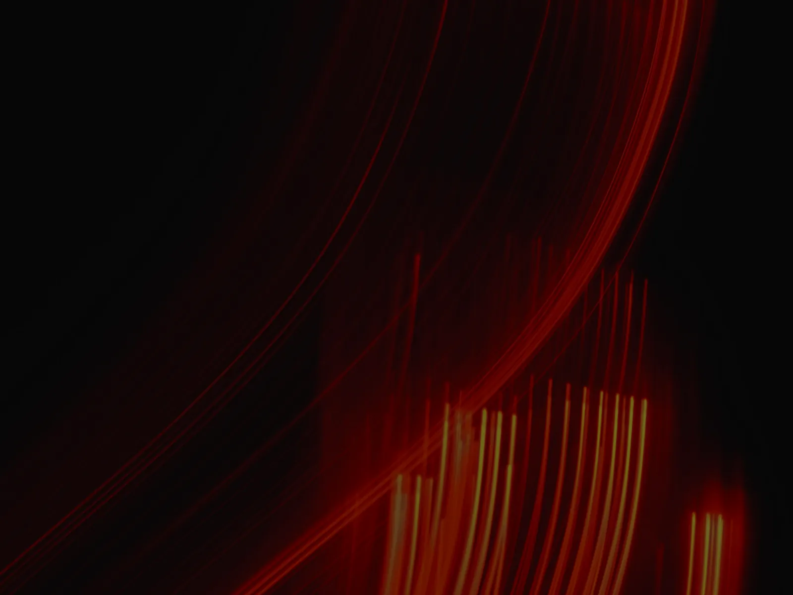Long-exposure red light trails on black